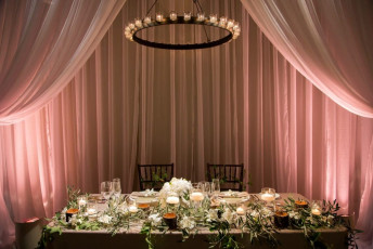 Chiffon Drapery, Uplights, and a 30 Candle Iron Chandelier