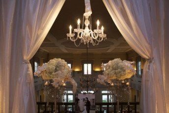 Ivory Taffeta Drapery, 5 Light Crystal Chandeliers, and Silver Table Chandeliers