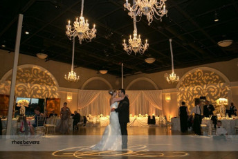 12 Light Crystal Chandeliers, Ivory Taffeta Drapery, Uplights, and GOBO Washes