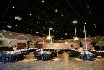 12 Light Crystal Chandeliers, Ivory Taffeta Drapery, GOBO Washes, and Table Spotlights