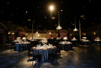 12 Light Crystal Chandeliers, Ivory Taffeta Drapery, GOBO Washes, and Table Spotlights