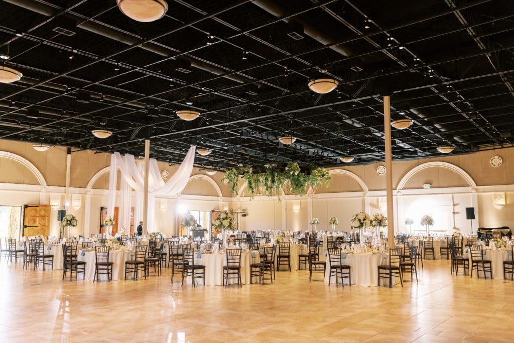 Wedding Reception setup at Casa Real with hanging greenery chandelier 