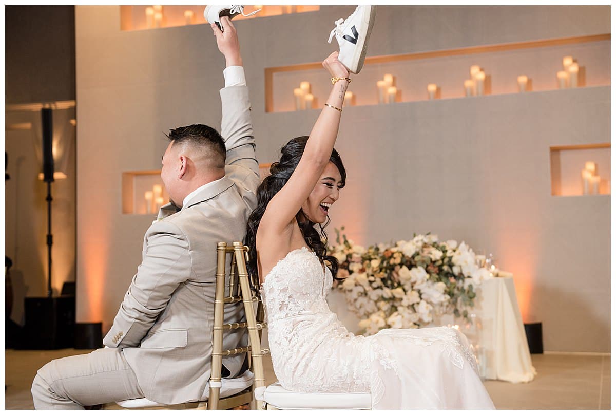 bride and groom playing shoe game