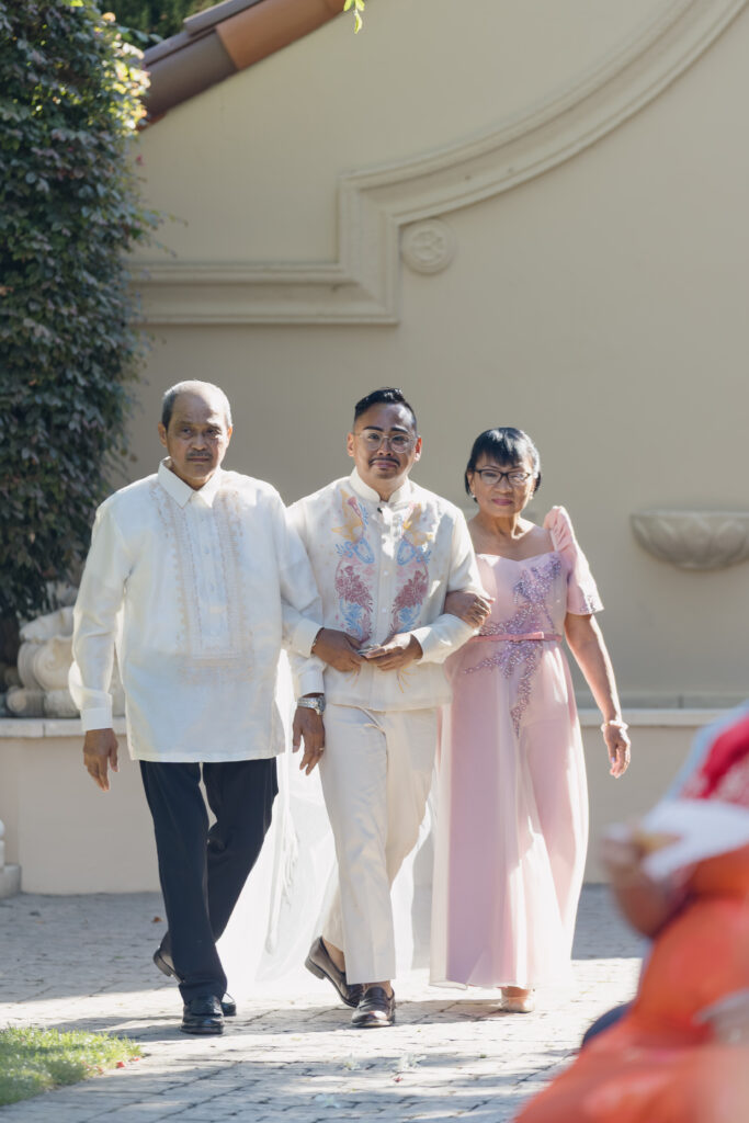 groom walks down aisle