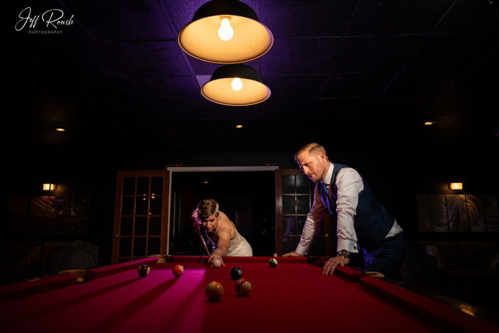 wedding couple playing pool